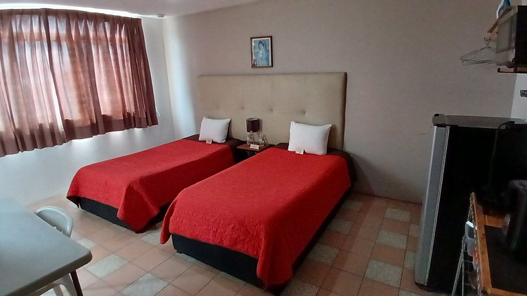 Suite Azalea, cocineta, baño privado, ubicación